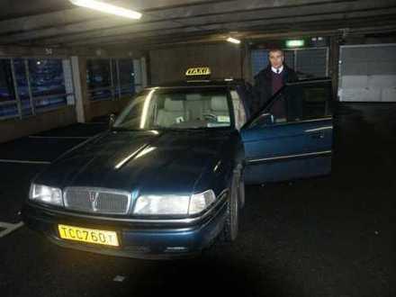 Naser Elmisurati with his Rover 827 Si as taxi 
