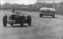 Peter Wilkes kör en Marauder 100 på Goodwood-banan 1952. Mike Hawthorn i en Riley ligger före.
