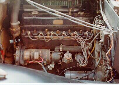 The engine has a reverse manifold port layout to the 1934 and 1935 models. They are on the far side of the head in this picture.